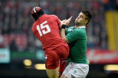 140315 - Wales v Ireland - RBS Six Nations - Leigh Halfpenny of Wales competes with Conor Murray of Ireland