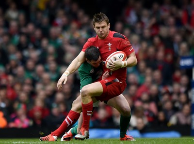 140315 - Wales v Ireland - RBS Six Nations - Dan Biggar of Wales is tackled by Johnny Sexton of Ireland