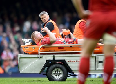 140315 - Wales v Ireland - RBS Six Nations - Samson Lee of Wales gives the thumbs up as he is taken off the pitch injured