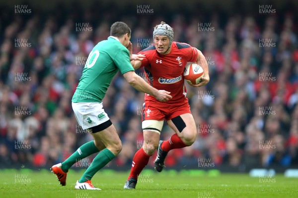 140315 - Wales v Ireland - RBS 6 Nations 2015 -Jonathan Davies of Wales gets away from Jonny Sexton of Ireland