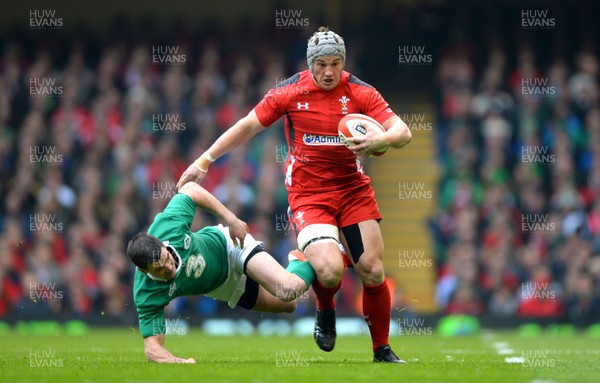 140315 - Wales v Ireland - RBS 6 Nations 2015 -Jonathan Davies of Wales gets away from Jonny Sexton of Ireland