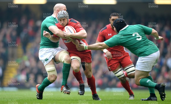 140315 - Wales v Ireland - RBS 6 Nations 2015 -Jonathan Davies of Wales is tackled by Paul O’Connell and Mike Ross of Ireland