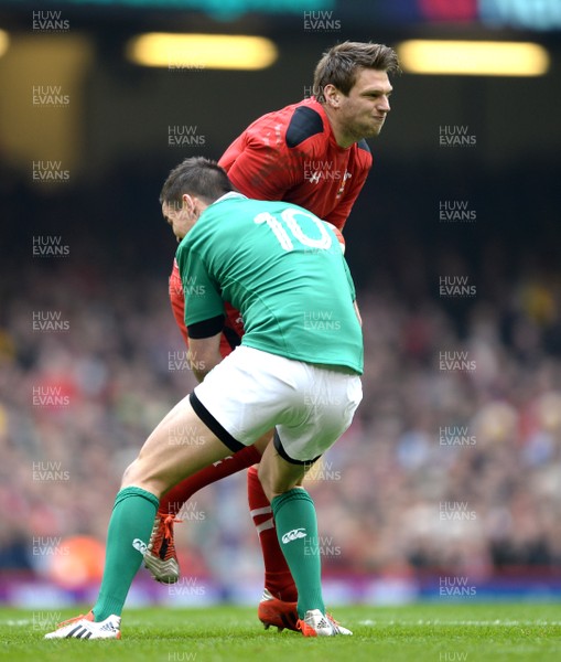 140315 - Wales v Ireland - RBS 6 Nations 2015 -Dan Biggar of Wales is tackled by Jonny Sexton of Ireland