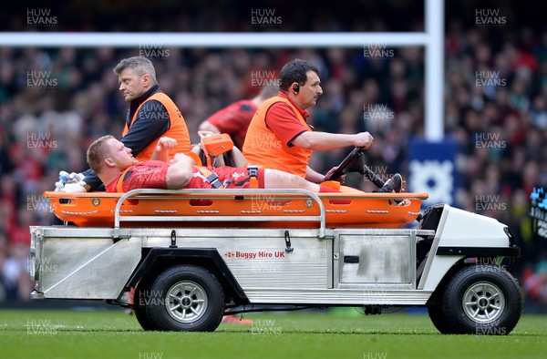 140315 - Wales v Ireland - RBS 6 Nations 2015 -Samson Lee of Wales leaves the field with an injury