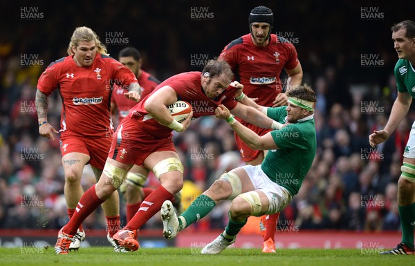 140315 - Wales v Ireland - RBS 6 Nations 2015 -Alun Wyn Jones of Wales is tackled by Jamie Heaslip of Ireland