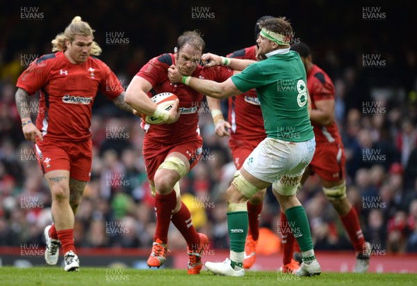 140315 - Wales v Ireland - RBS 6 Nations 2015 -Alun Wyn Jones of Wales is tackled by Jamie Heaslip of Ireland