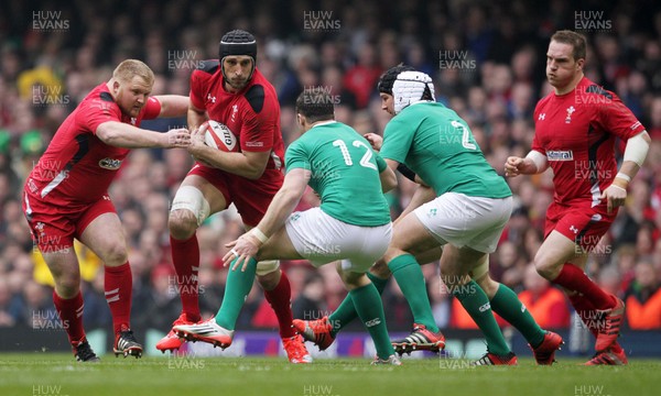 140315 - Wales v Ireland - RBS 6 Nations - Luke Charteris of Wales takes on Robbie Henshaw and Rory Best of Ireland