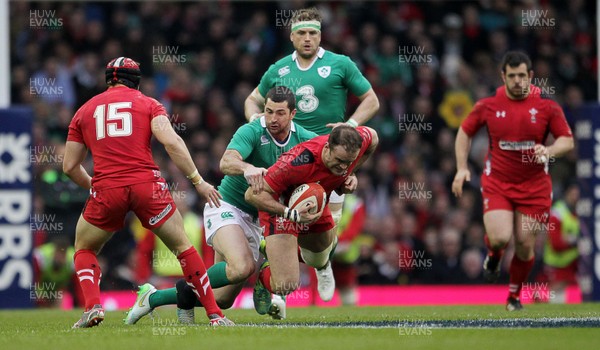 140315 - Wales v Ireland - RBS 6 Nations - Jamie Roberts of Wales is tackled by Rob Kearney of Ireland