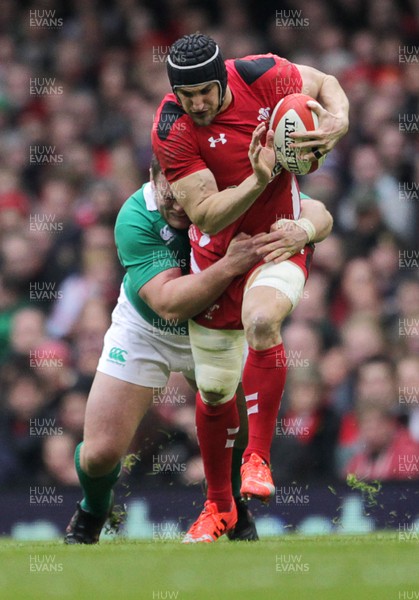 140315 - Wales v Ireland - RBS 6 Nations - Sam Warburton of Wales is tackled by Jack McGrath of Ireland