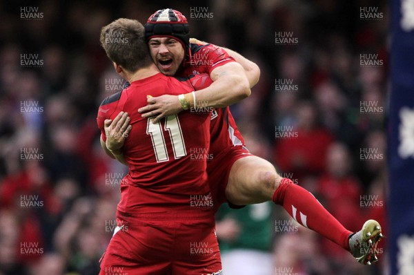 140315 - Wales v Ireland - RBS 6 Nations - Liam Williams  and Leigh Halfpenny of Wales celebrate the victory at full time