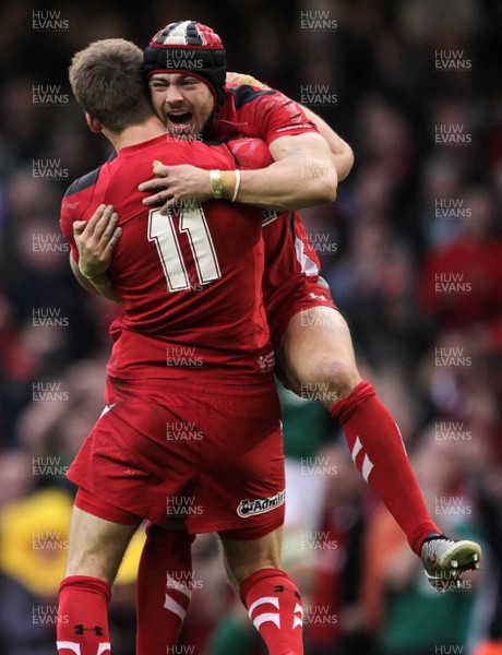 140315 - Wales v Ireland - RBS 6 Nations - Liam Williams  and Leigh Halfpenny of Wales celebrate the victory at full time