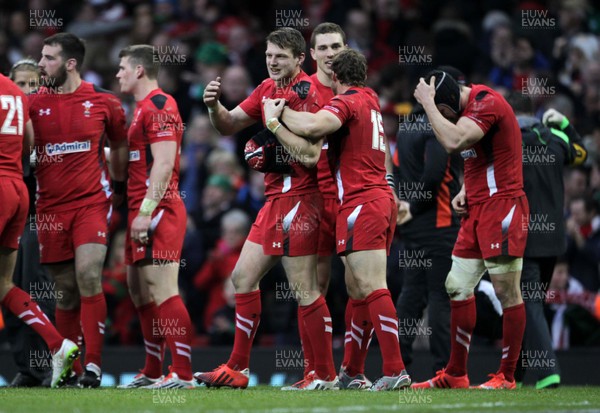 140315 - Wales v Ireland - RBS 6 Nations - Dan Biggar and Leigh Halfpenny of Wales celebrate at full time