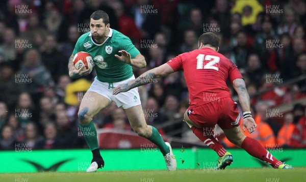 140315 - Wales v Ireland - RBS 6 Nations - Rob Kearney of Ireland is gets past Jamie Roberts of Wales