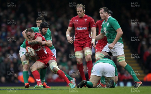 140315 - Wales v Ireland - RBS 6 Nations - Jamie Roberts of Wales is tackled by Sean OÕBrien of Ireland