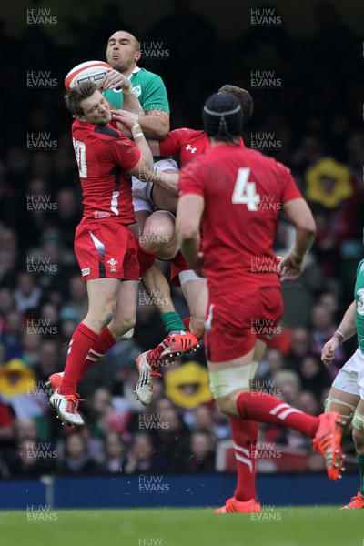 140315 - Wales v Ireland - RBS 6 Nations - Dan Biggar of Wales and Rob Kearney of Ireland jump for the ball