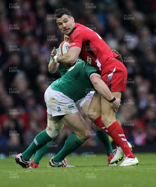 140315 - Wales v Ireland - RBS 6 Nations - Mike Phillips of Wales is tackled by Mike Ross of Ireland