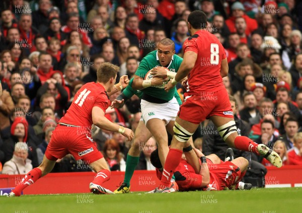 140315 - Wales v Ireland - RBS 6 Nations -Simon Zebo of Ireland is tackled by Scott Baldwin of Wales