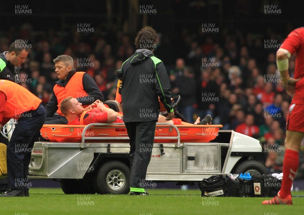 140315 - Wales v Ireland - RBS 6 Nations -Samson Lee of Wales leaves the field on a stretcher