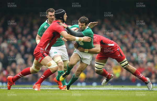 140315 - Wales v Ireland, RBS 6 Nations 2015 - Jared Payne of Ireland is tackled by Luke Charteris of Wales and Taulupe Faletau of Wales