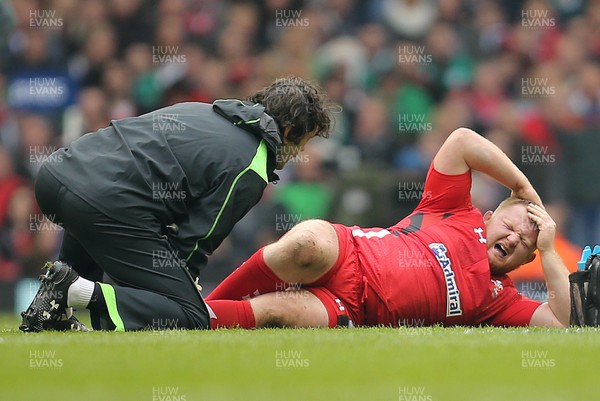 140315 - Wales v Ireland, RBS 6 Nations 2015 - Samson Lee of Wales shows the pain as he receives treatment before leaving the field with an injury