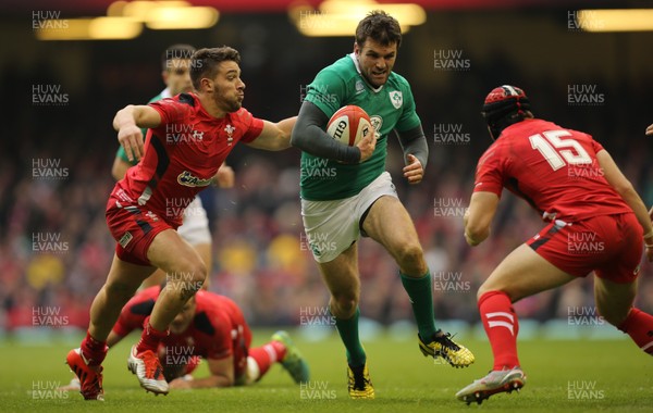 140315 - Wales v Ireland, RBS 6 Nations 2015 - Jared Payne of Ireland takes on Rhys Webb of Wales and Leigh Halfpenny of Wales