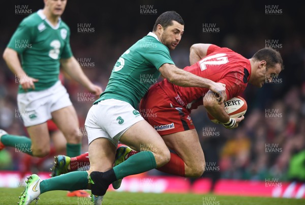 140315 - Wales v Ireland - RBS Six Nations - Wales Jamie Roberts is tackled by Rob Kearney