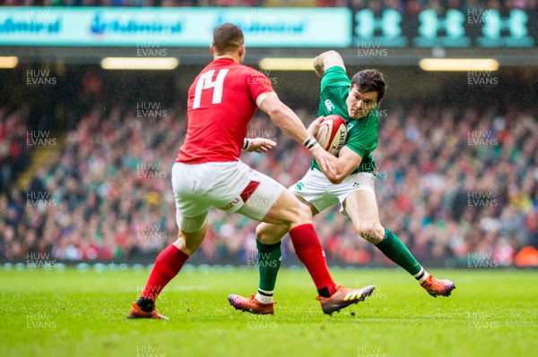 160319 - Wales v Ireland - Guinness Six Nations - Jacob Stockdale of Ireland tries to get past George North of Wales 