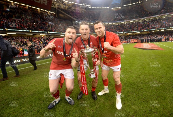 160319 - Wales v Ireland - Guinness Six Nations - Rob Evans, Jonathan Davies and Gareth Davies of Wales celebrates