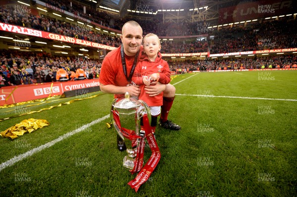 160319 - Wales v Ireland - Guinness Six Nations - Ken Owens and his son Evan of Wales celebrates