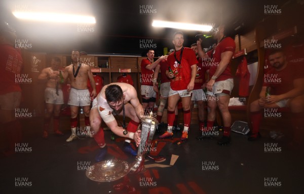 160319 - Wales v Ireland - Guinness Six Nations - Josh Adams of Wales with the trophy in the dressing room
