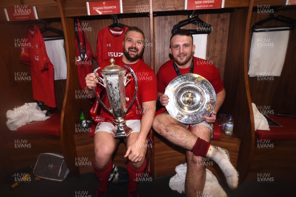 160319 - Wales v Ireland - Guinness Six Nations - Tomas Francis and Dillon Lewis of Wales with the trophy in the dressing room