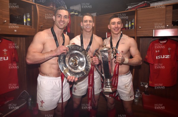 160319 - Wales v Ireland - Guinness Six Nations - George North, Liam Williams and Josh Adams with the trophy in the dressing room