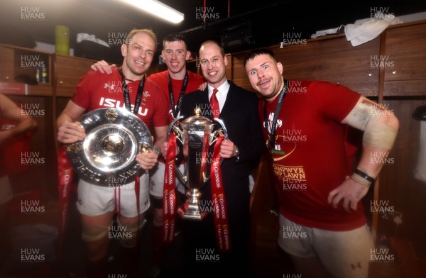 160319 - Wales v Ireland - Guinness Six Nations - Alun Wyn Jones, Adam Beard and Rob Evans of Wales with Prince William with the trophy in the dressing room