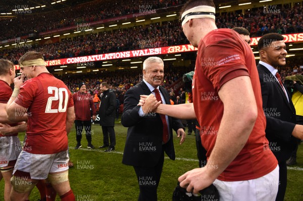 160319 - Wales v Ireland - Guinness Six Nations - Warren Gatland and Adam Beard of Wales celebrates at the end of the game