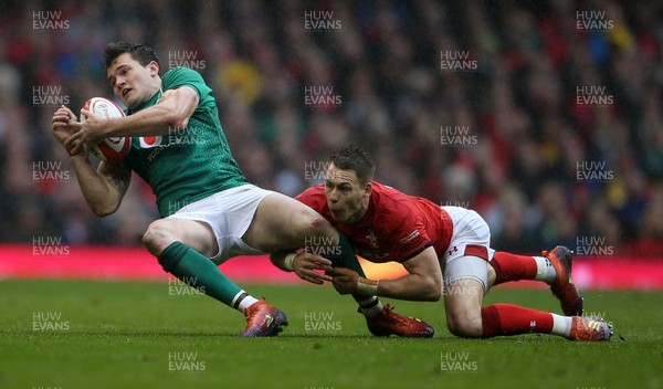 160319 - Wales v Ireland - Guinness 6 Nations Championship - Jacob Stockdale of Ireland is tackled by Liam Williams of Wales