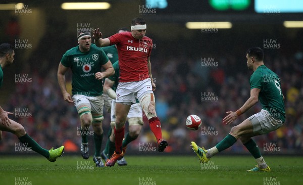 160319 - Wales v Ireland - Guinness 6 Nations Championship - Dan Biggar of Wales kicks the ball through