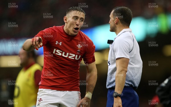 160319 - Wales v Ireland - Guinness 6 Nations Championship - Josh Adams of Wales has words with the linesman