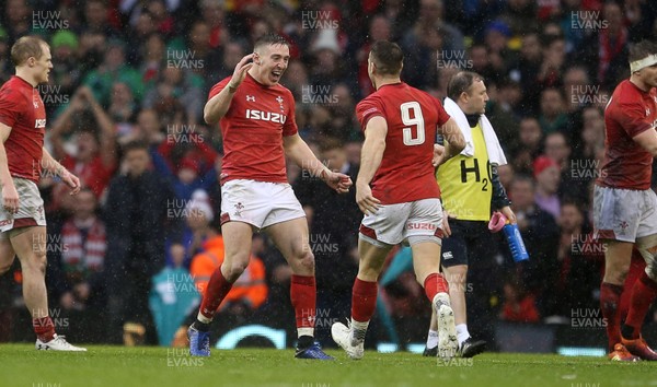160319 - Wales v Ireland - Guinness 6 Nations Championship - Josh Adams and Gareth Davies of Wales celebrate on the whistle