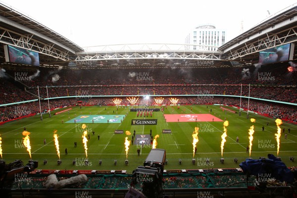160319 - Wales v Ireland - Guinness Six Nations -  Players of Wales and Ireland take the field as pyrotechnics flame 