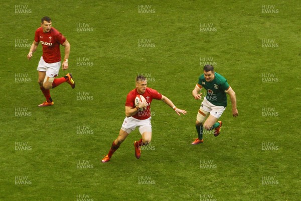 160319 - Wales v Ireland - Guinness Six Nations -  Gareth Anscombe of Wales beats Johnny Sexton of Irleand