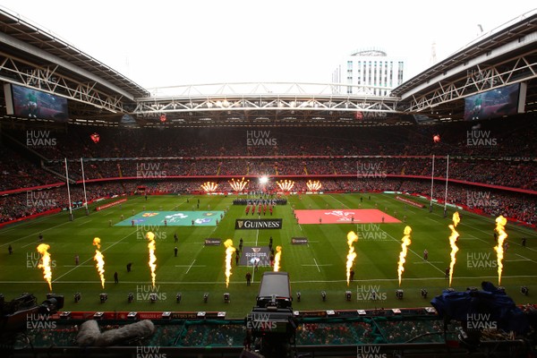 160319 - Wales v Ireland - Guinness Six Nations -  Players of Wales and Ireland take to the field as pyrotechnics flame