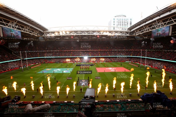 160319 - Wales v Ireland - Guinness Six Nations -  Players of Wales and Ireland take to the field as pyrotechnics flame 