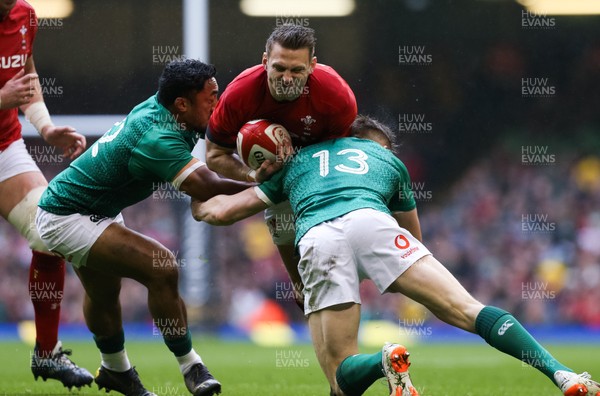 160319 - Wales v Ireland, Guinness Six Nations Championship 2019 - Dan Biggar of Wales is tackled by Bundee Aki of Ireland and Garry Ringrose of Ireland