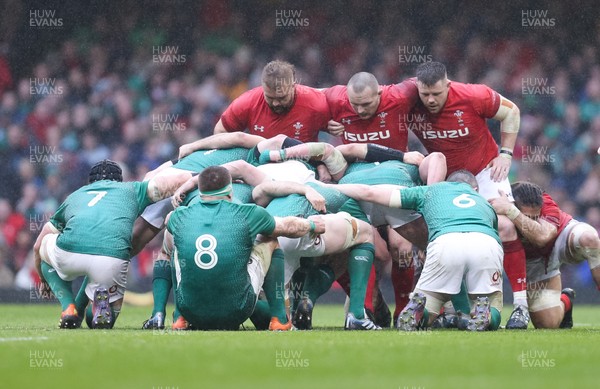160319 - Wales v Ireland, Guinness Six Nations Championship 2019 - The Welsh front row, Tomas Francis, Ken Owens and Rob Evans wait to pack down