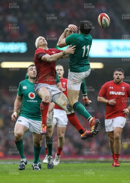 160319 - Wales v Ireland, Guinness Six Nations Championship 2019 - Dan Biggar of Wales  and Jacob Stockdale of Ireland compete for the ball