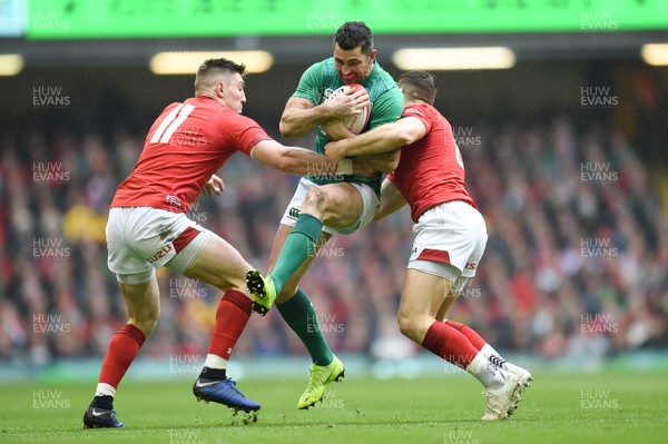 160319 - Wales v Ireland - Guinness Six Nations - Rob Kearney of Ireland is tackled by Josh Adams of Wales  and Gareth Davies of Wales 