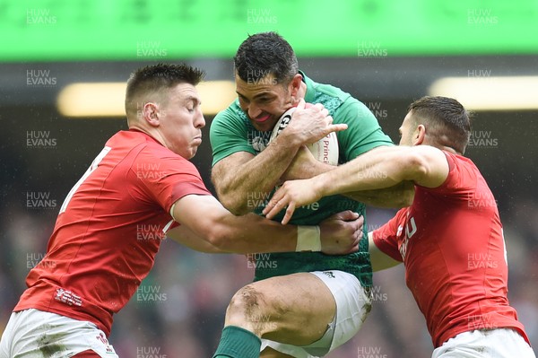 160319 - Wales v Ireland - Guinness Six Nations - Rob Kearney of Ireland is tackled by Josh Adams of Wales  and Gareth Davies of Wales 
