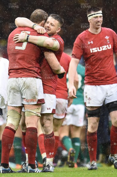 160319 - Wales v Ireland - Guinness Six Nations - Rob Evans of Wales and Alun Wyn Jones of Wales  celebrate winning the Guinness Six Nations and the Grand Slam