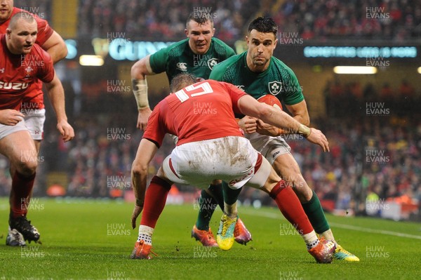 160319 - Wales v Ireland - Guinness Six Nations - Conor Murray of Ireland is tackled by Liam Williams of Wales 