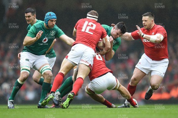 160319 - Wales v Ireland - Guinness Six Nations - James Ryan of Ireland is tackled by Hadleigh Parkes of Wales and Ross Moriarty of Wales 